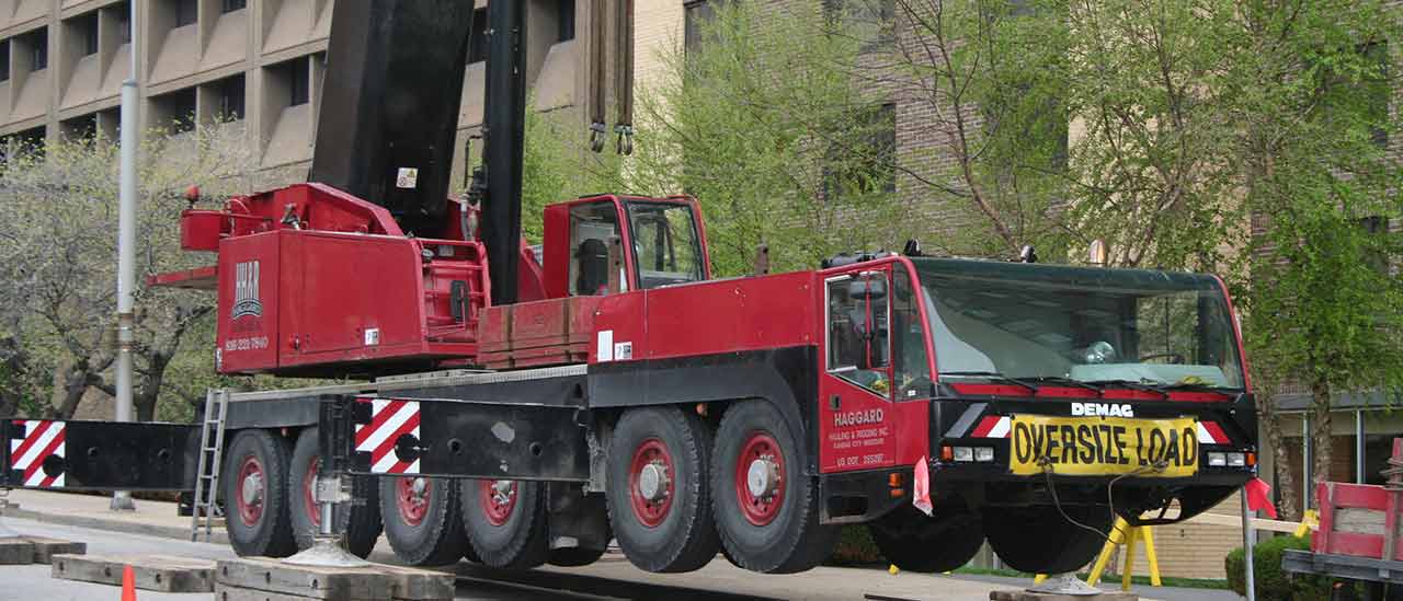 Metro-condos-crane-balancing-above-the-street-banner-2